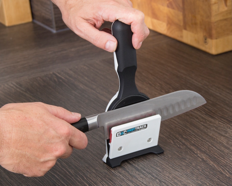 Kitchen knife with clearance sharpener